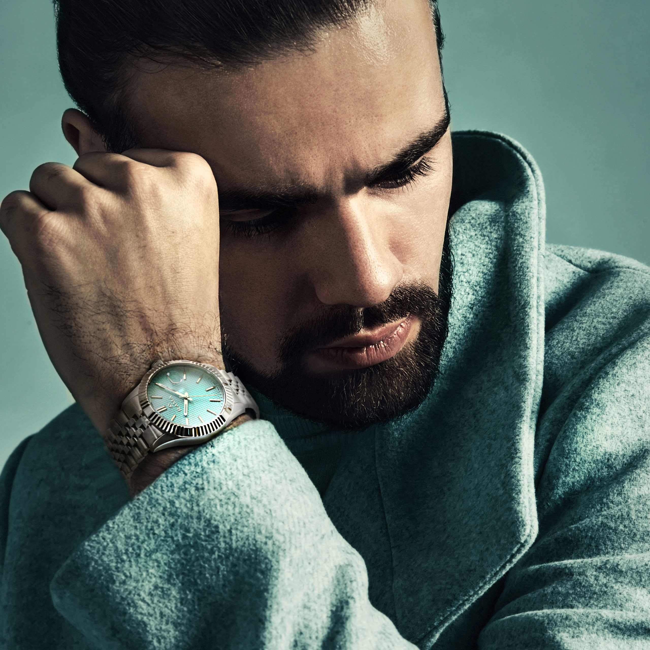 Portrait of young handsome man posing in studio